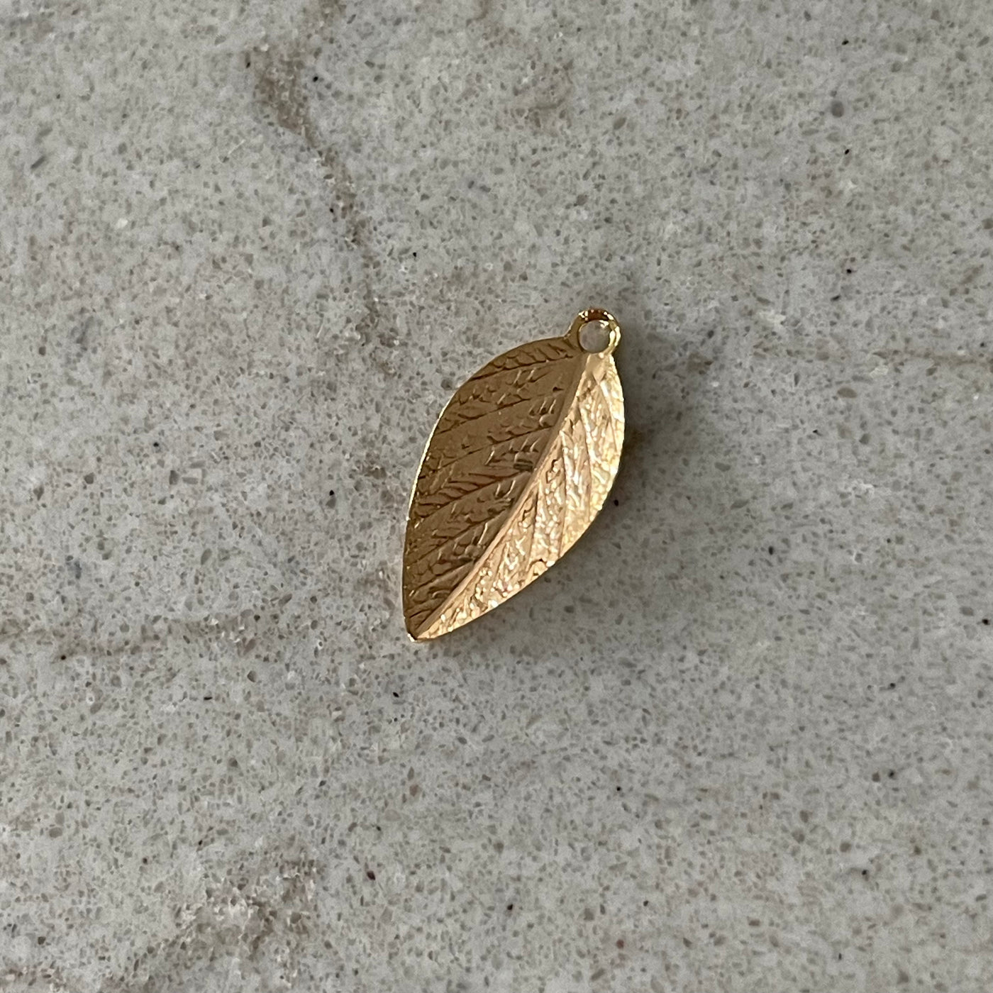 Thin golden leaf charm