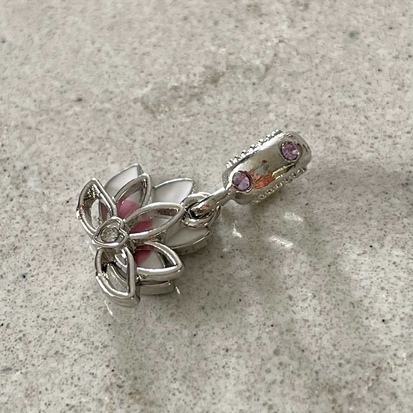 Lotus charm on ring