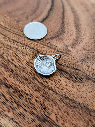 Breloque coquillage précieux argent