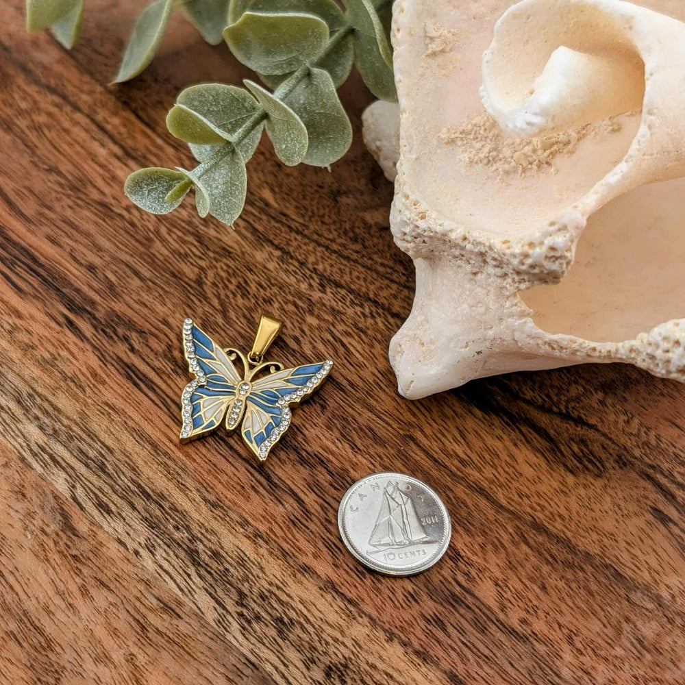 Papillon coloré rose ou bleu avec zircon