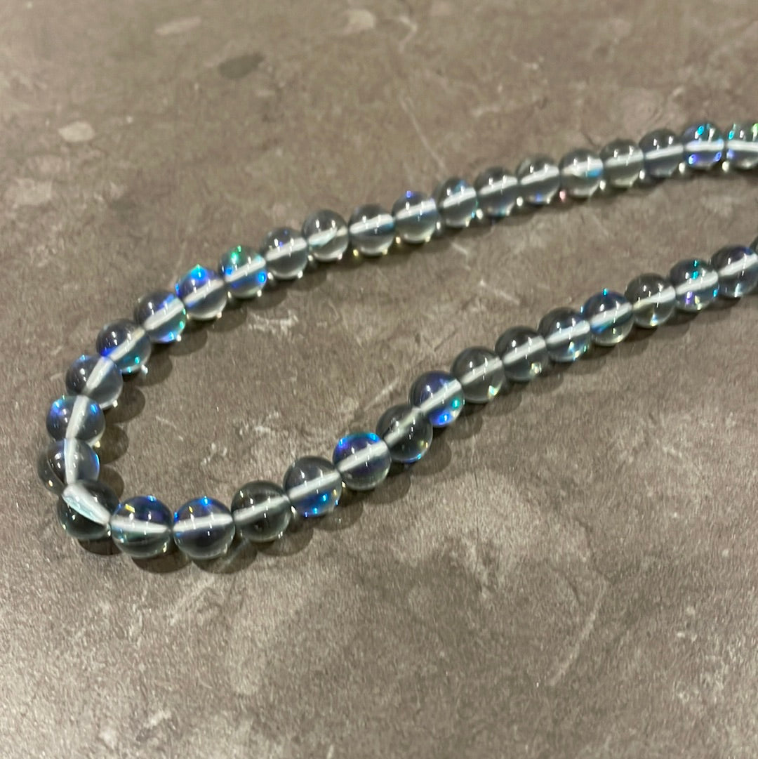 Gray synthetic moonstone rope with blue-green highlights