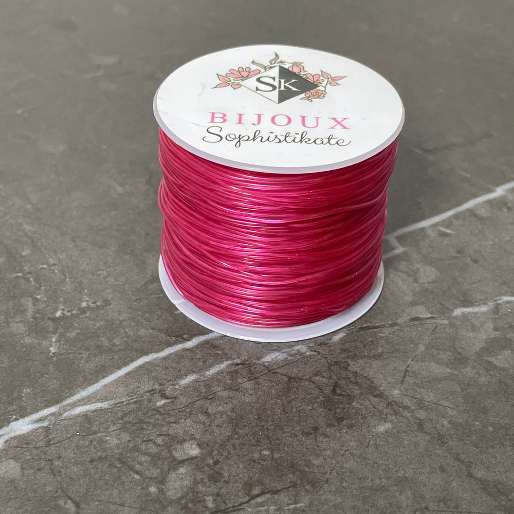 Bobine de fil élastique couleur framboise