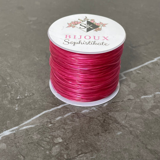 Bobine de fil élastique couleur framboise