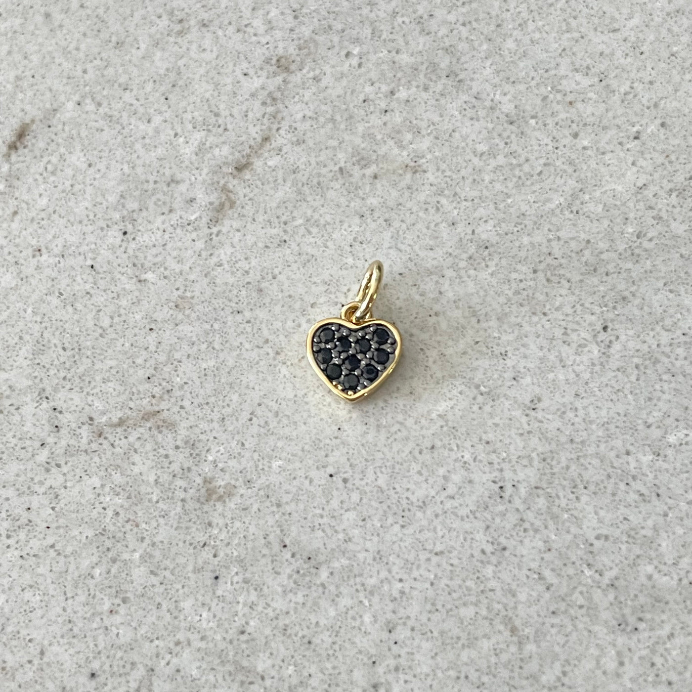 Gold heart charm paved with black zircons