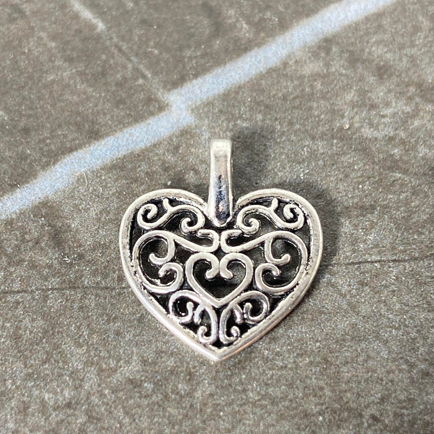 Flourish heart charm