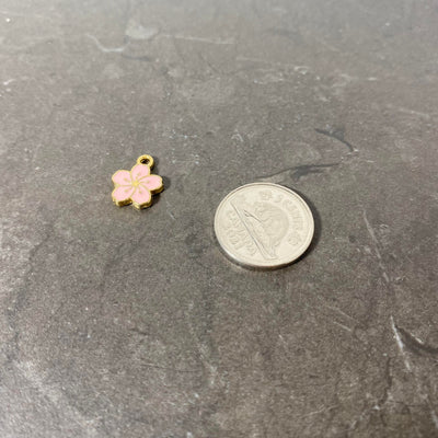 Breloque de petite fleur hawaïenne rose bébé