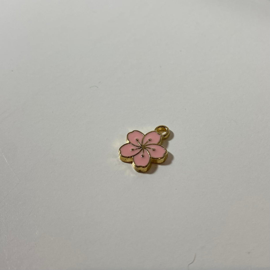 Breloque de petite fleur hawaïenne rose bébé