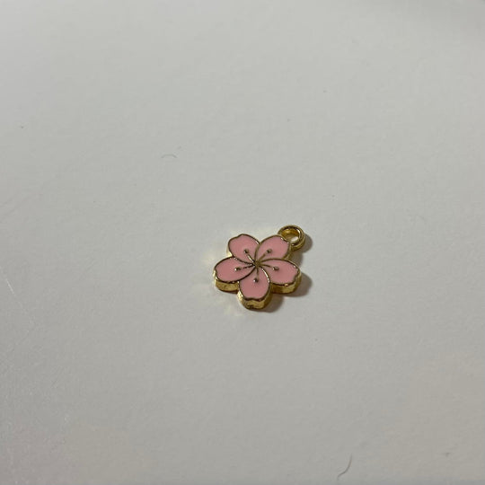 Breloque de petite fleur hawaïenne rose bébé