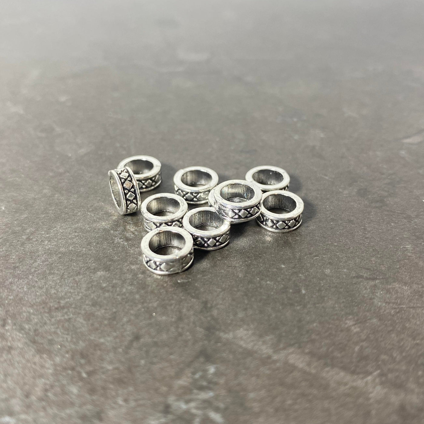 Set of silver spacers with X pattern