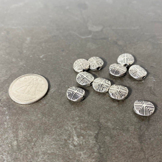 Lot de pastilles argenté avec motif gravé
