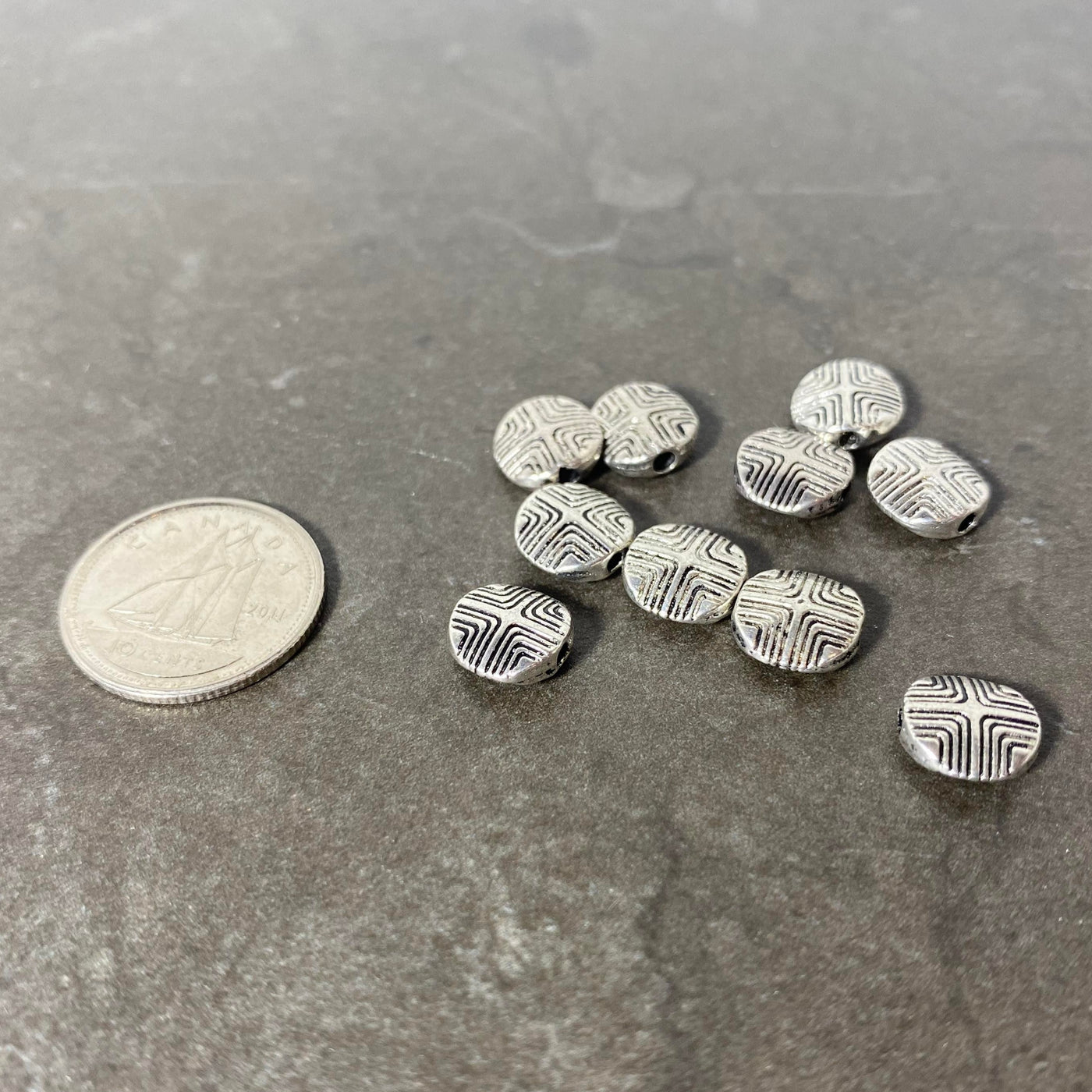 Set of silver pellets with engraved pattern
