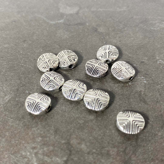 Lot de pastilles argenté avec motif gravé