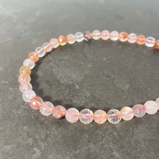 Corde de quartz rutilé facetté 6mm