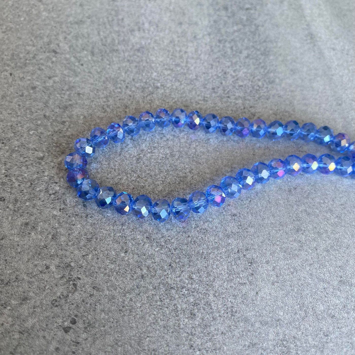 Rope of pale blue faceted oval Czech glass crystals