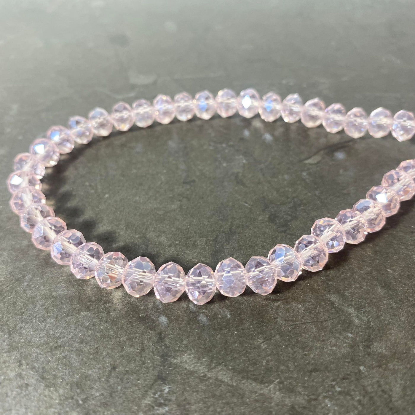 Corde de cristaux de verre tchèque ovale facetté rose pâle