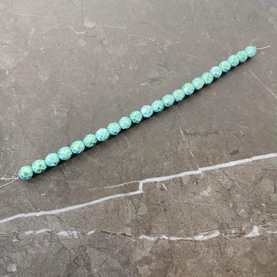 Gold-tinted turquoise faceted Czech glass rope 6 or 8 mm.