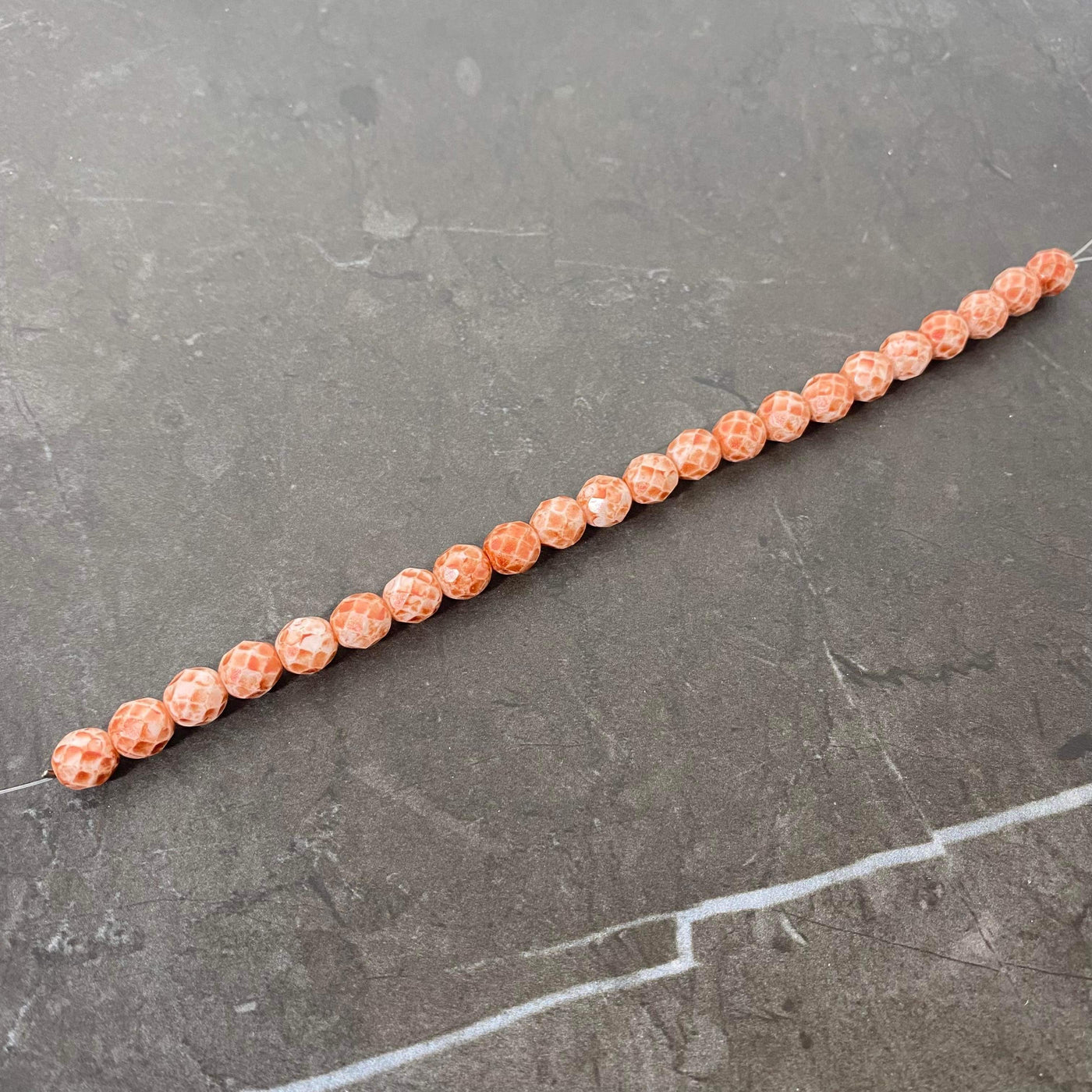 Orange coral faceted Czech glass rope 8 mm.