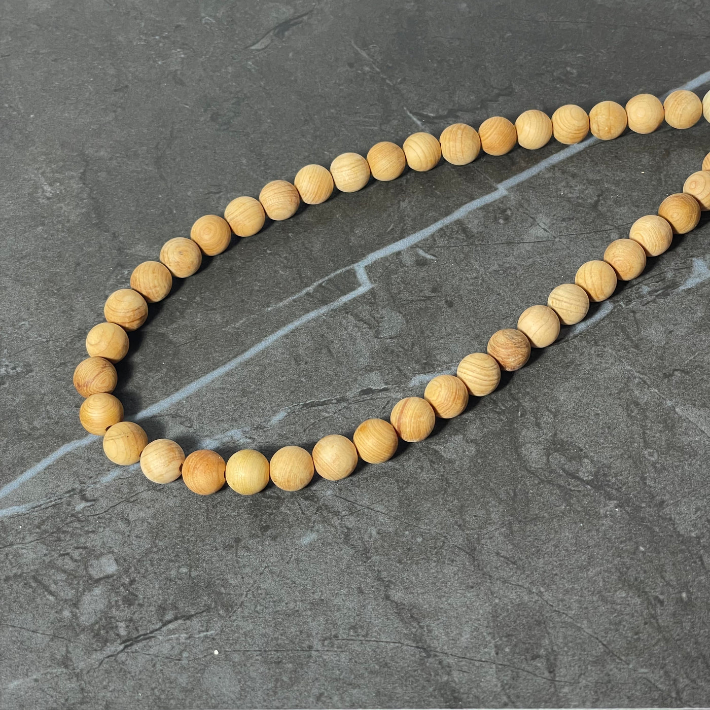 Rope of pale wooden beads 8 mm